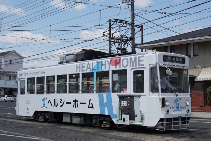 鉄道乗車記録の写真:乗車した列車(外観)(1)        「岡山に来て初めて乗ったのが不動産会社の広告電車です。」